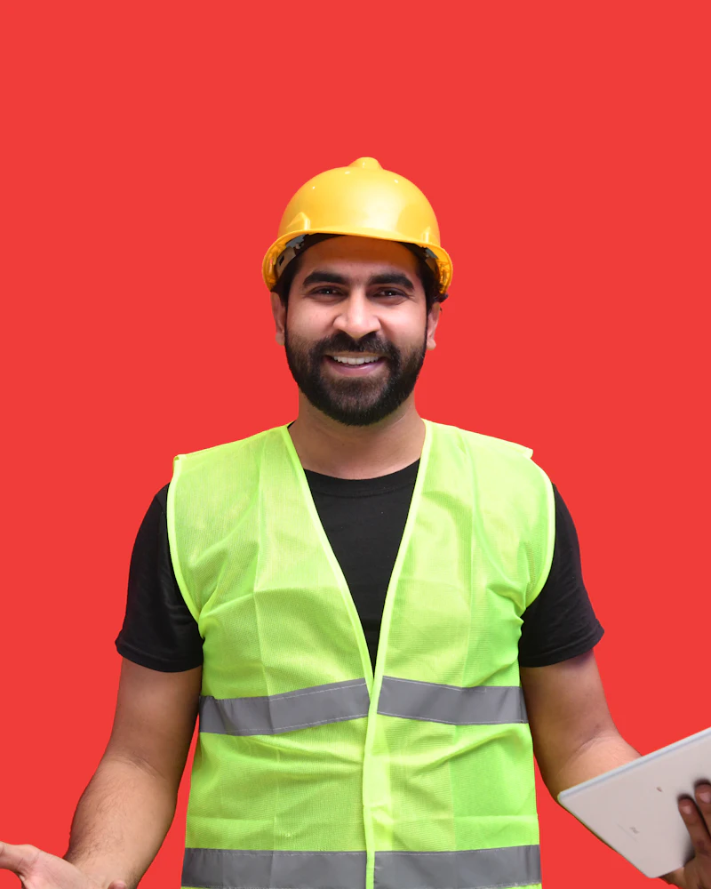 Smiling construction worker in hi-vis vest and hard hat